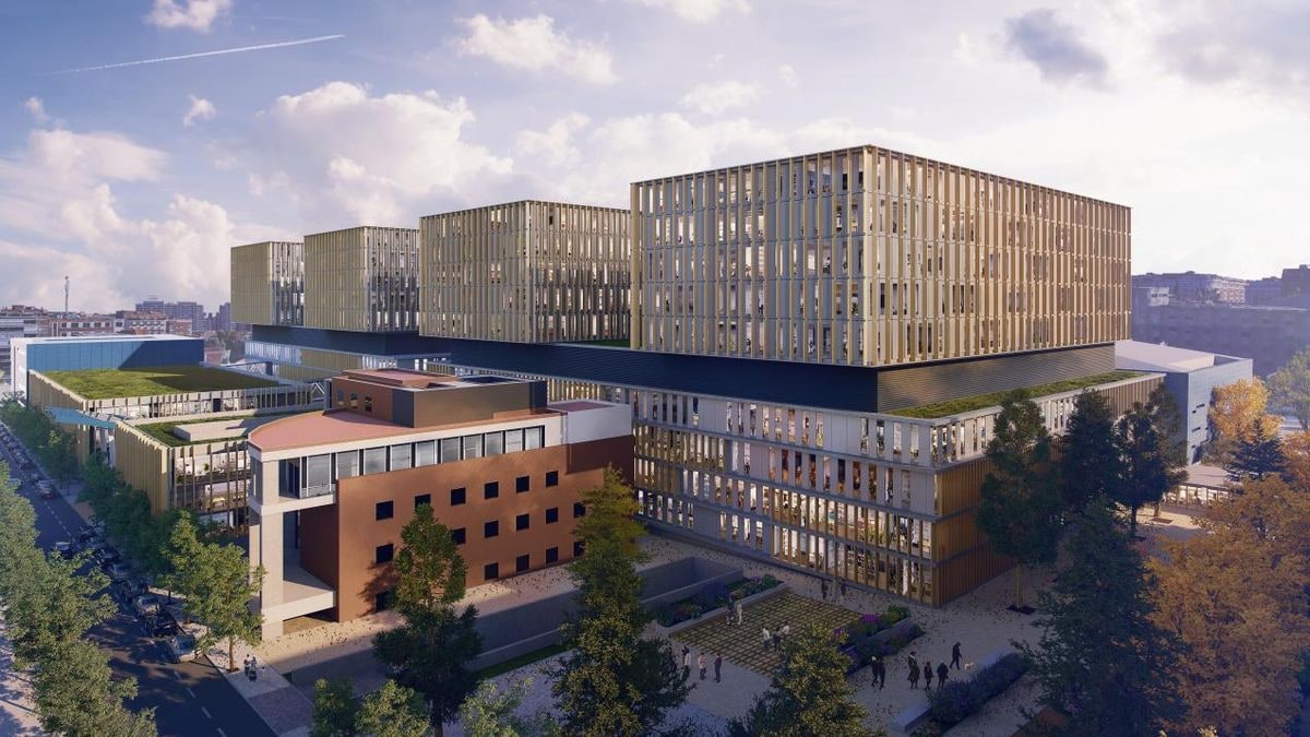 Imagen ilustrativa: fachada de un hospital moderno a contraluz al atardecer