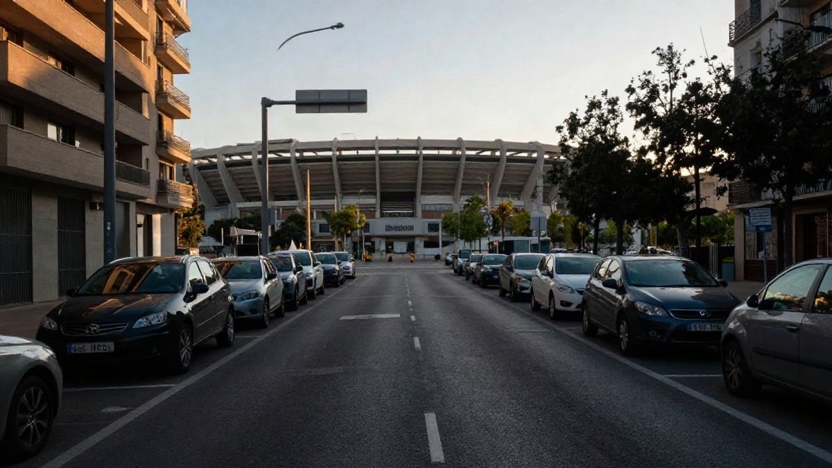 Imagen ilustrativa: calle de ciudad con coches aparcados y un estadio al fondo