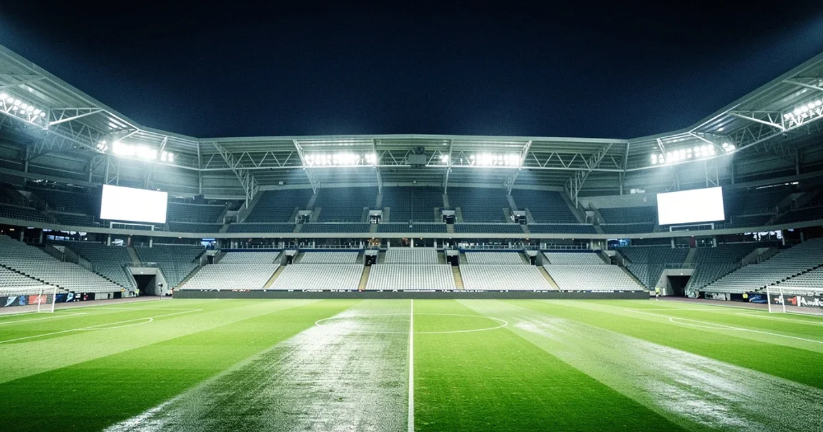 Estadio moderno iluminado por la noche listo para un partido